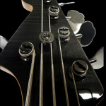 Headstock closeup, 5-string 24-fret bass guitar
