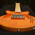 Scaled-down electric guitar, body carve detail. Phoenix model link 13